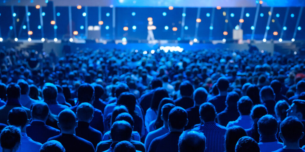 Speaker on a stage with audience